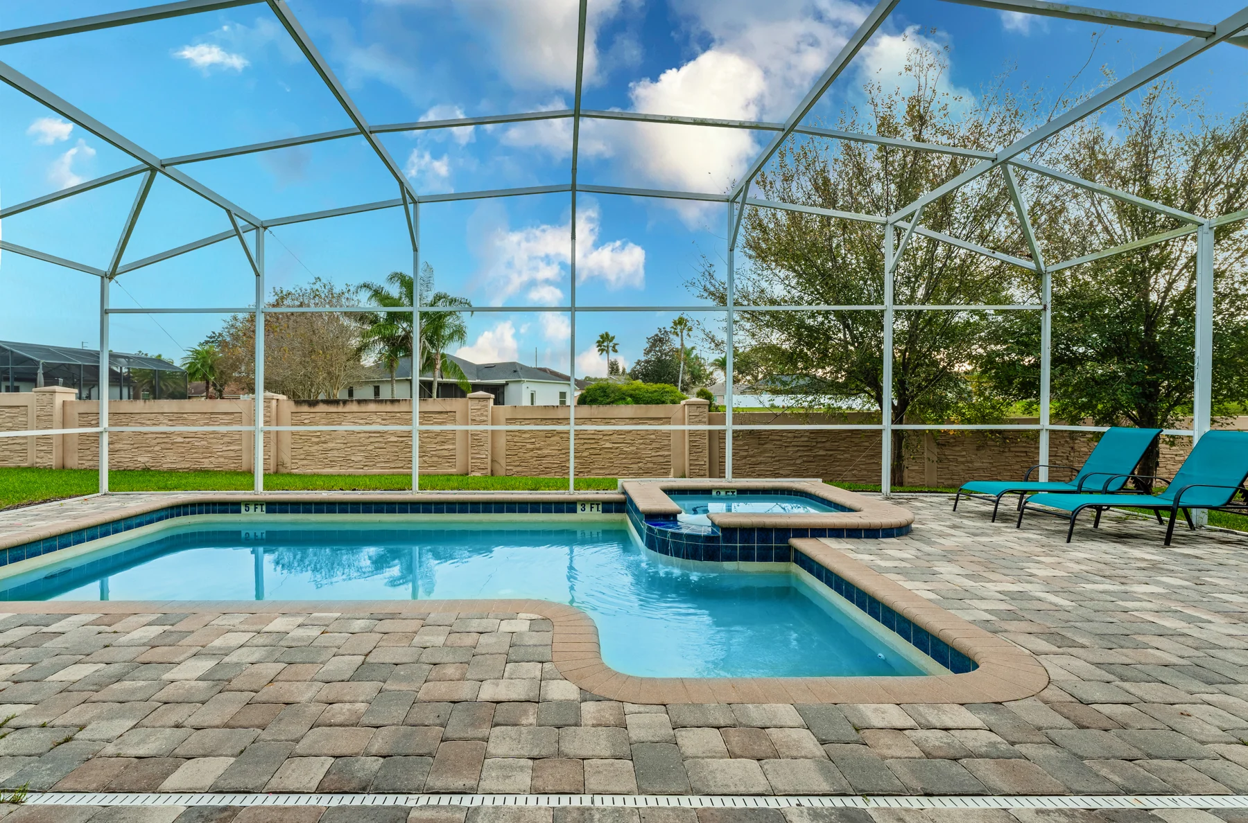 The private screened pool and spa